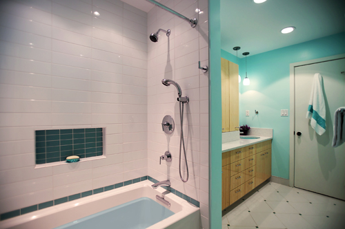 Bathroom with teal walls, bamboo cabinetry, and double head shower - view 1