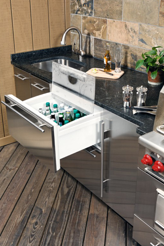 Outdoor kitchen iwth stainless cabinets and black countertops - view 5 - focus on pullout refrigerator