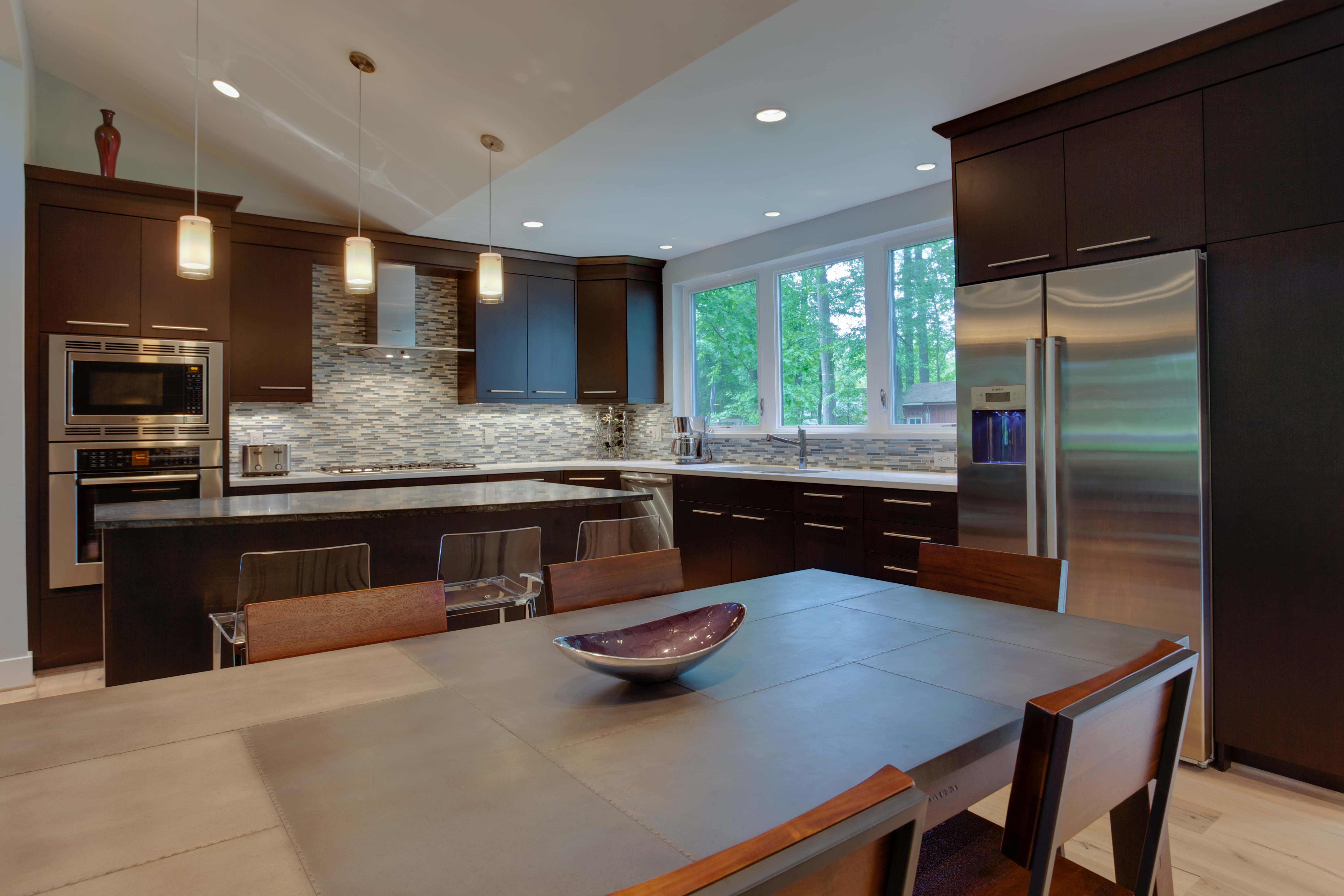 View of kitchen with brown kitchen cabinets and stainless appliances
