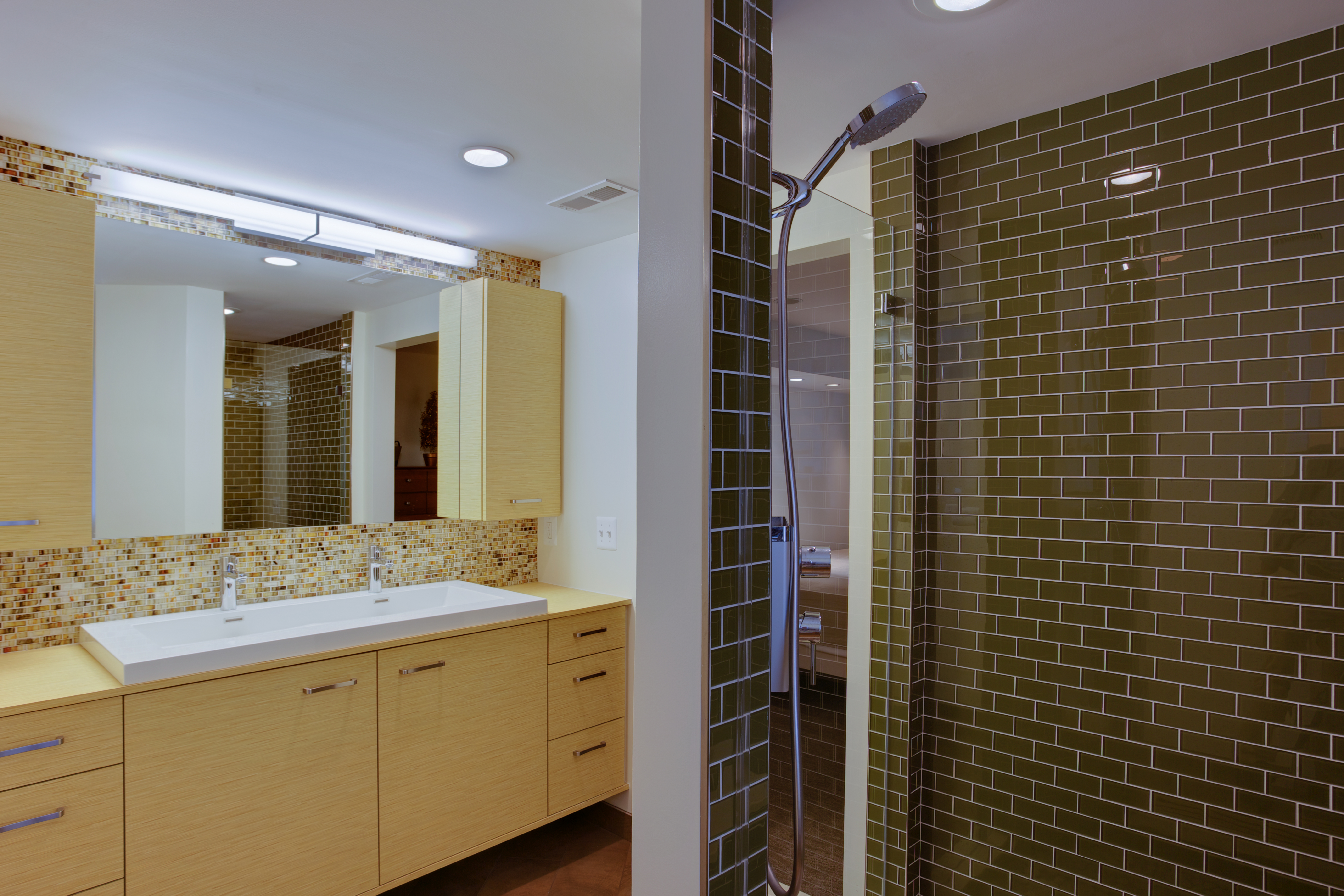 Bathroom with double vanity and yellow, wood cabinetry - view 3 - brown tile in shower