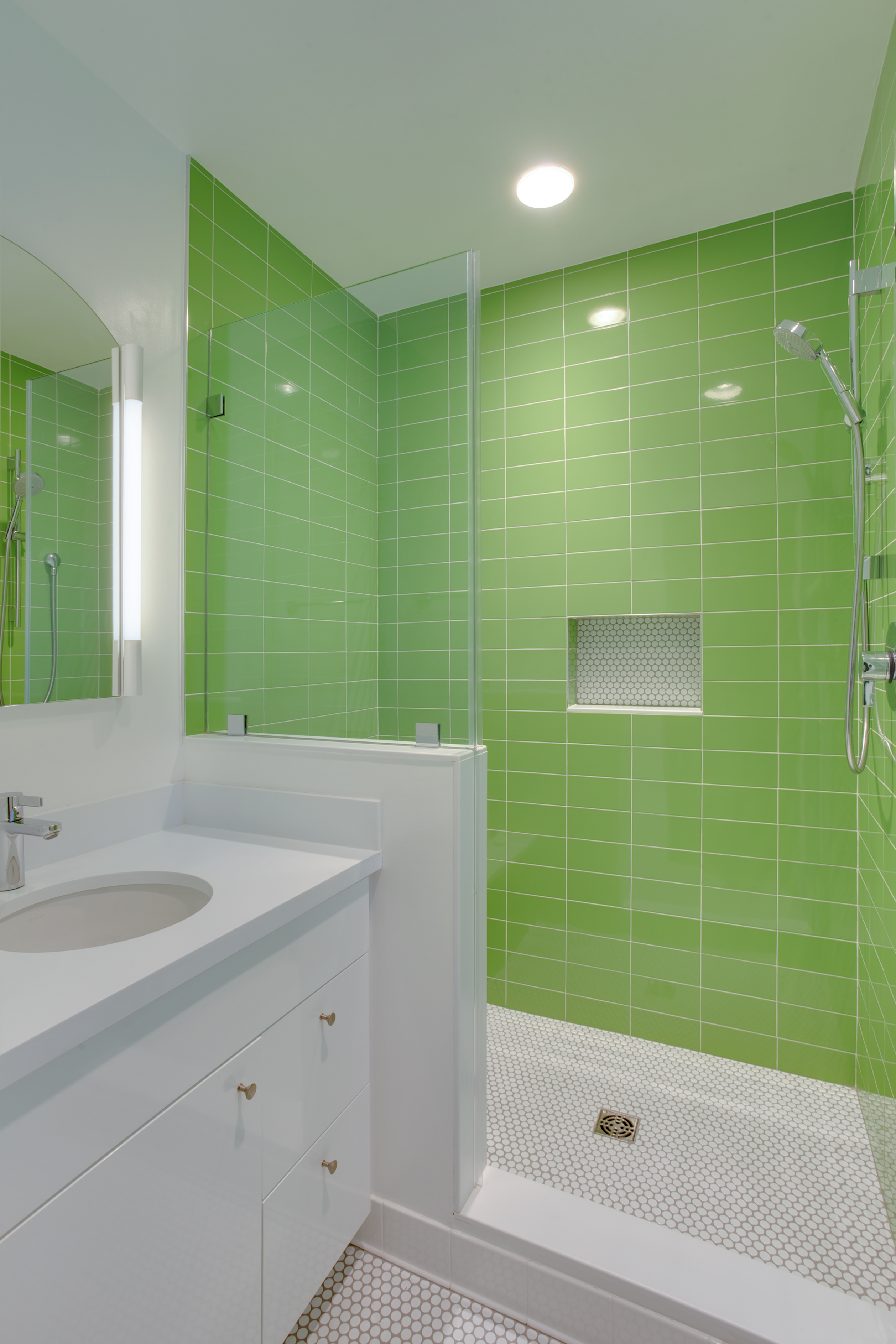 Green tile walk-in shower with white vanity - view 2
